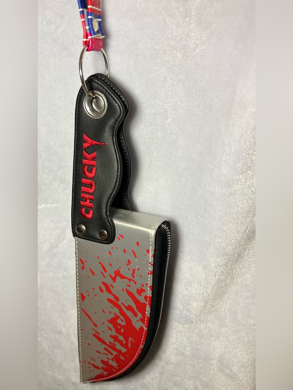 Spencer's Silver & Red Chucky Phone Case Pouch with Keyring Strap
